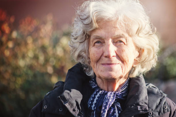 istock Beautiful Senior Woman Outdoors Lost in Thoughts 610972036