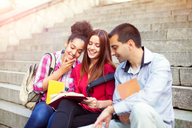 istock Students outdoor with books 610972664