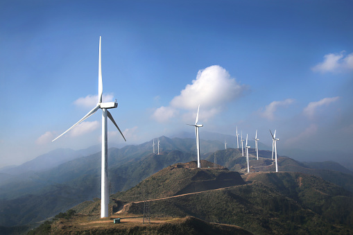 High altitude wind farms in the blue sky white cloud background