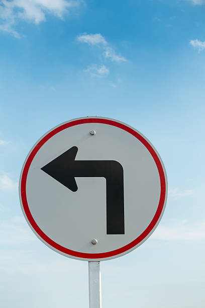 istock Turn left traffic sign on skies background. 610974552
