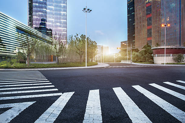 istock city empty traffic road with cityscape in background 610974720