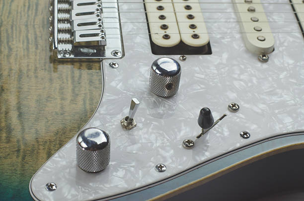 istock Electric guitar teal color close up 610974926