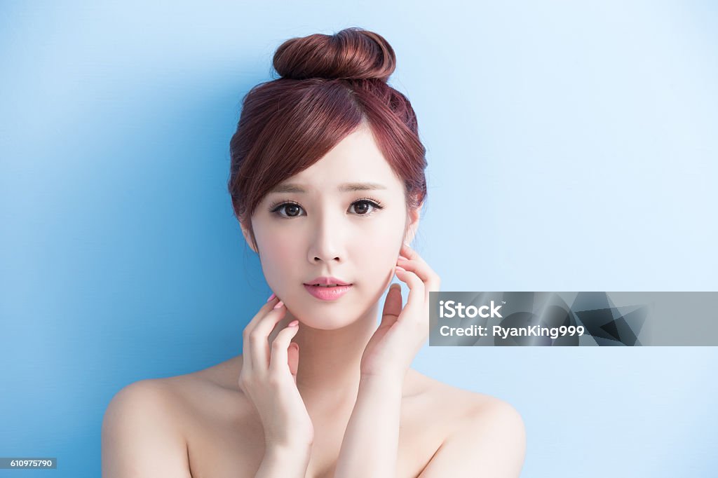 beauty woman smile to you beauty  skin care woman smile to you isolated on bluebackground, asian Asia Stock Photo