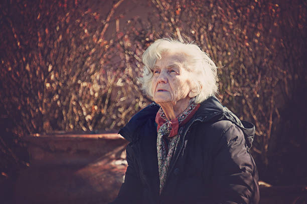 istock Beautiful Senior Woman Outdoors, Lost in Thoughts 610976584