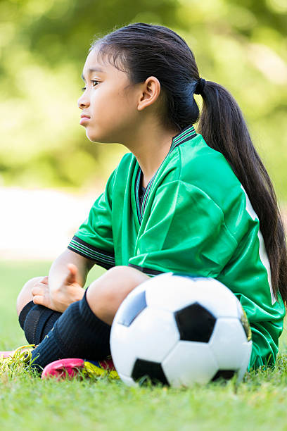 istock Sad little girl after soccer game 610977246