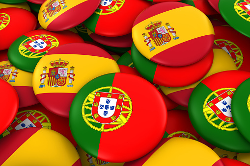 Spain and Portugal Badges Background - Pile of Spanish and Portuguese Flag Buttons 3D Illustration