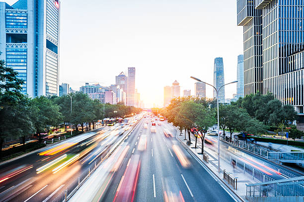 istock traffic light trails on urban street 610979628