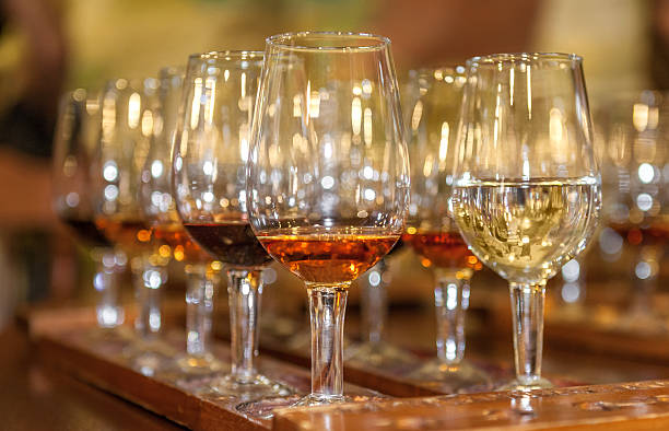 istock Tasting red and white wine. A tray with glasses. Closeup 610980210