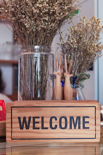 Welcome sign on wooden board.