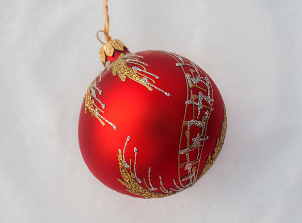 istock christmas red balls on snow 610982600