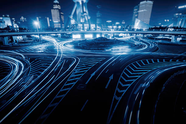 istock vehicle light trails at central district of shanghai 610985400