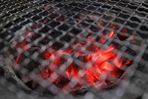 istock Barbecue Fire Grill close-up, isolated on Black Background 610986768