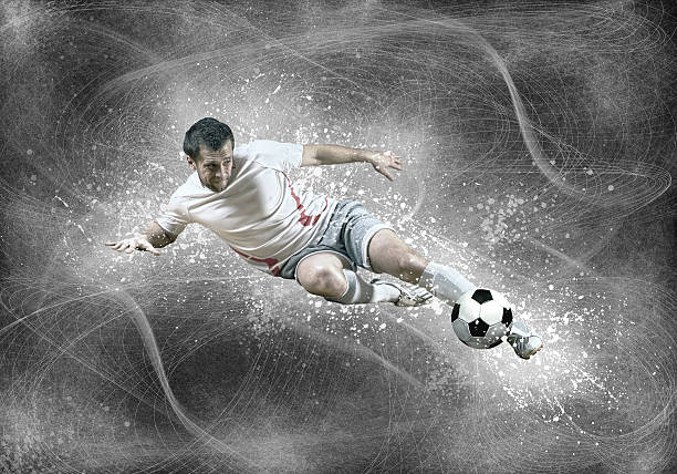 istock Football player with ball in action under sky with clouds 610986830