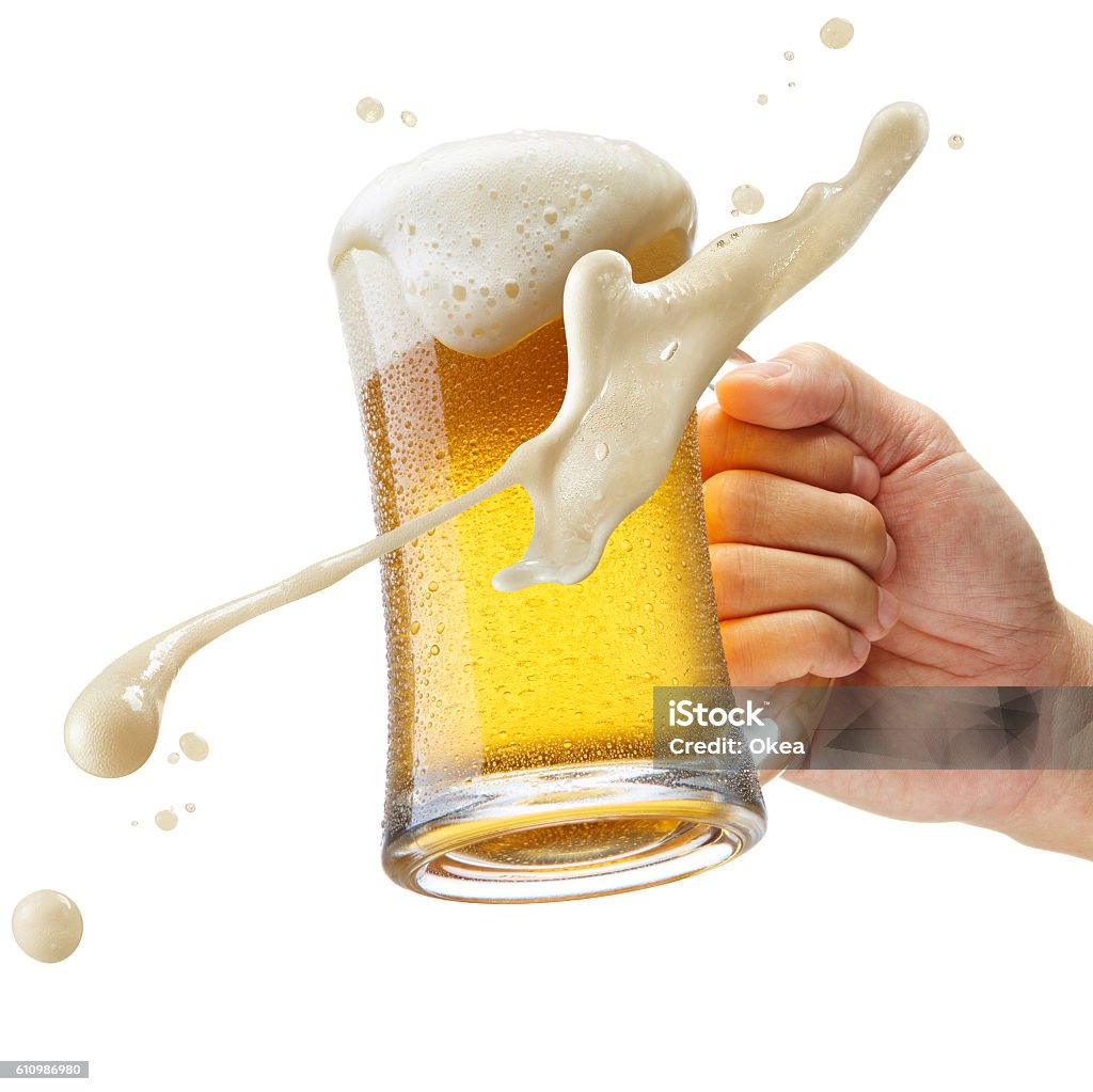 cheers hand holding a mug of beer toasting Beer - Alcohol Stock Photo