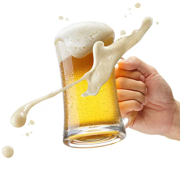 hand holding a mug of beer toasting