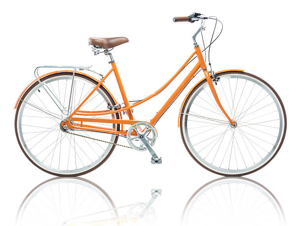 istock Stylish female orange bicycle isolated on white 610986984