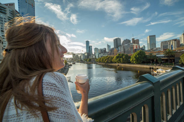 istock Young woman with coffee mug in Melbourne 610987314