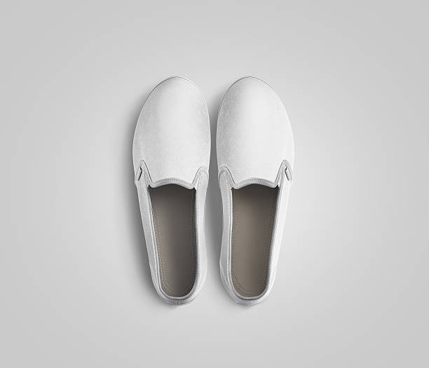 istock Blank white slip-on shoes pair design mockup, top view, 610987874