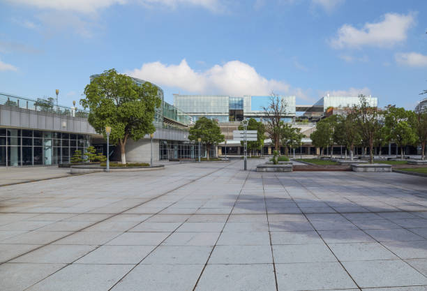 istock empty pavement and modern buildings in city 610990598