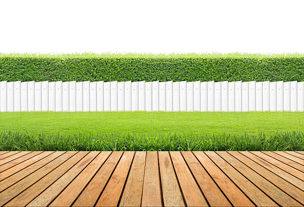 istock Lawn and wooden floor with hedge 611062838
