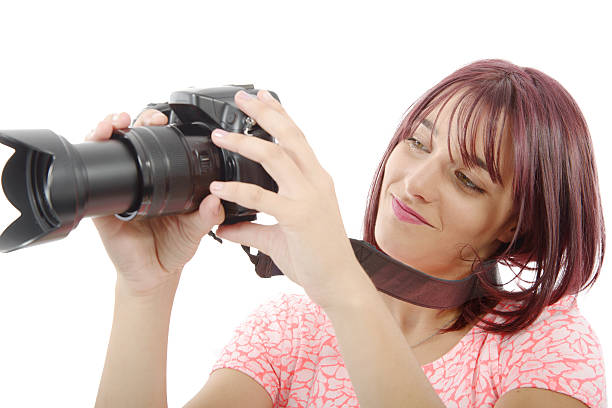 istock Young woman with photo camera.on white background 611063154