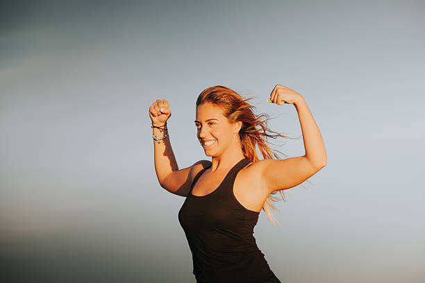 istock Happy girl showing body strength. 611063246