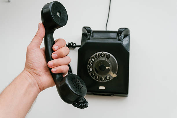 istock Black retro phone on a white background with rotary dial 611063254