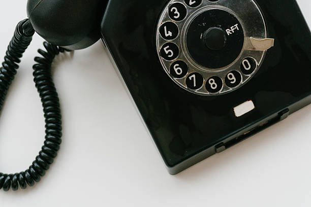 istock Black retro phone on a white background with rotary dial 611063750