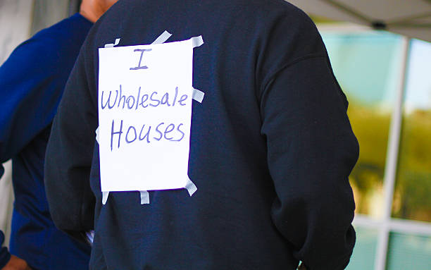 istock Man Selling Houses Wholesale - Stock Image 611063762