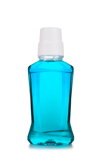 Plastic bottle of mouthwash isolated on white background