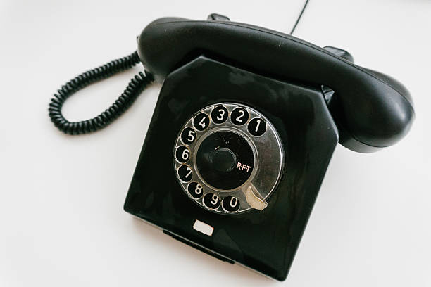 istock Black retro phone on a white background with rotary dial 611064038