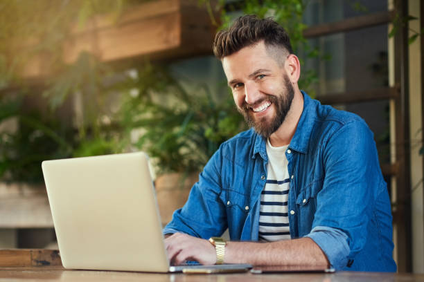 istock Getting some work done at his favourite local cafe 611065916