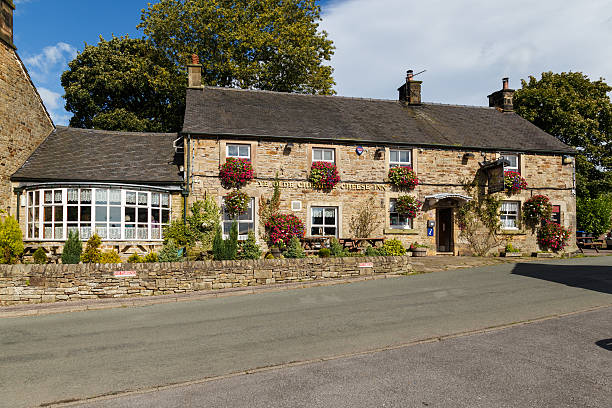 Longnor, England - September 28, 2016: Stone bus shelter on Buxton Road. In Longnor, Staffordshire, England. On 28th September 2016.
