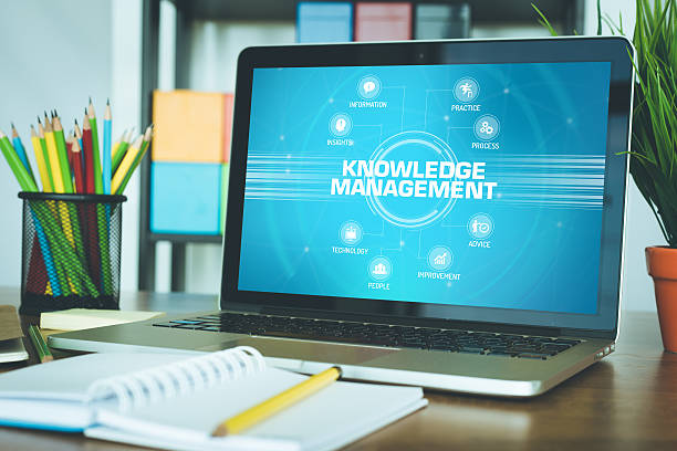 istock KNOWLEDGE MANAGEMENT chart with keywords and icons on screen 611067584