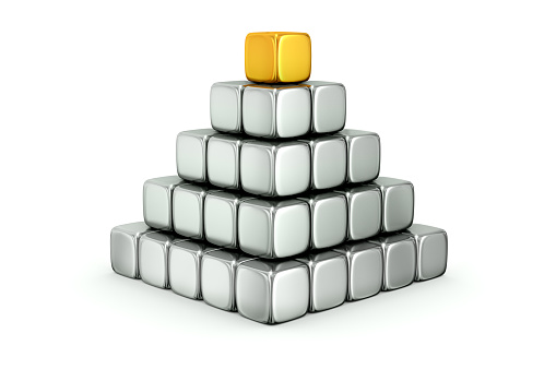 3D rendered pyramid structure created by silver cubic blocks with a golden cube on top isolated.