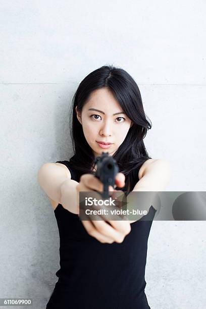 Japanese Spy Woman Holding A Gun Stock Photo - Download Image Now ...