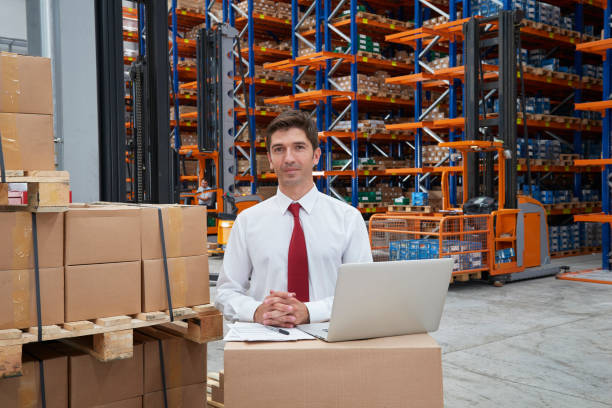 istock Male worker checking the storages in warehouse 611070352