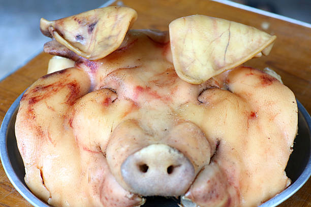 istock pig head Steam for Thai style banquet. 611070626