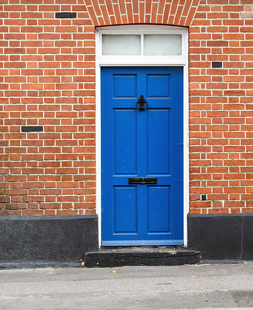 istock Blue Painted House Door and Brickwork 611071552