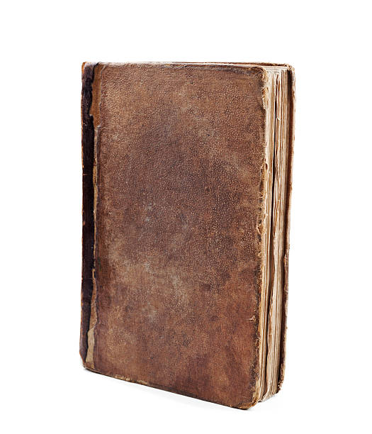 istock Old ancient book or foliant isolated on white 611072026