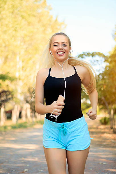 istock Beautiful Blonde Woman Running At Forest 611072076