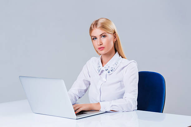 istock Young businesswoman working at laptop computer. 611073504