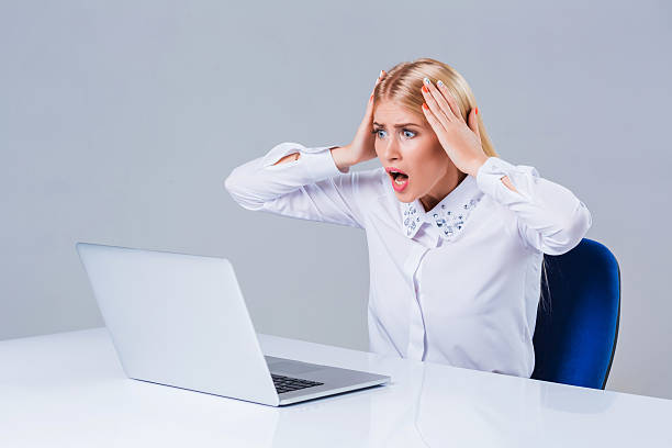 istock Young businesswoman working at laptop computer. 611074156