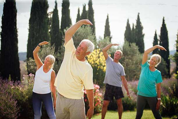istock Outdoors Yoga Class with Senior Adults 611074448