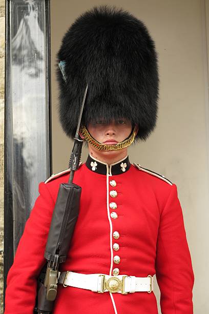 Young royal guard protecting Crown Jewels at Tower of London stock photo
