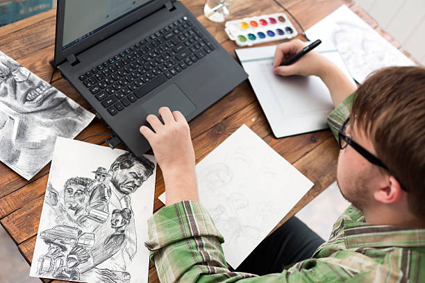 istock Artist drawing Sketch on Graphic Tablet Top View 611075408