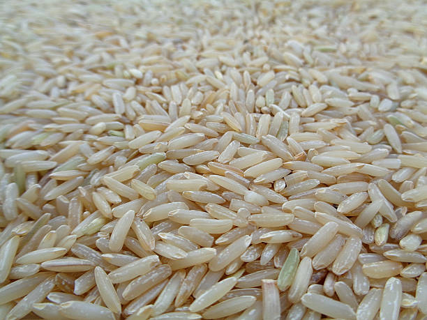 istock Raw Brown  Jasmine Rice Close-up for Background 611075452