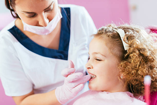 istock Dental check for kids at dentist 611077554