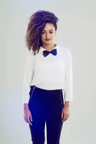 Shot of a funky young woman posing against a white background