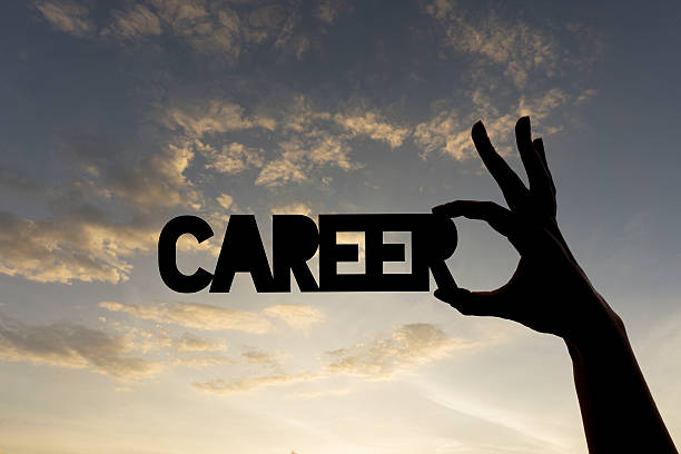 istock Career word being held against sky 611080880